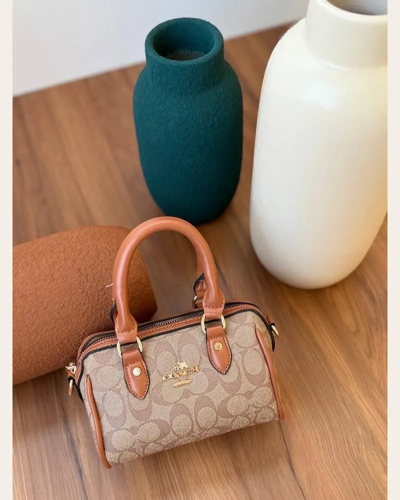 شنطة يد صغيرة أسطوانية بمقبضين 2